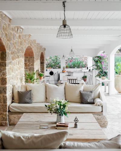 Covered terrace lounge shared space at Cuatre Finques