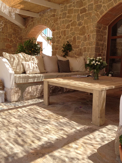 Stone-walled lounge nook at Cuatre Finques